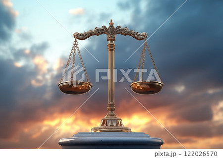 Golden scales of justice against a dramatic sunset sky in a legal setting 122026570