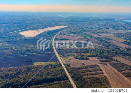 Aerial view of valley with farm fields, pond and Danube river. High quality photo 122026761