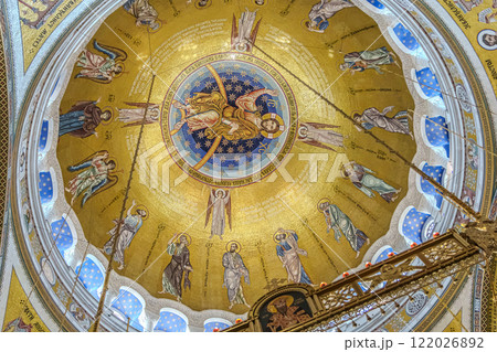 Belgrade, Serbia- 10162024: The Temple Of Saint Sava indoor interior, people pray in an Orthodox church, frescoes on the ceilings and walls of the church. High quality photo Belgrade, Serbia- 10162024: The Temple Of Saint Sava indoor interior, people pray in an Orthodox church, frescoes on the ceilings and walls of the church. High quality photo 122026892