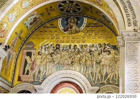 Belgrade, Serbia- 10162024: The Temple Of Saint Sava indoor interior, people pray in an Orthodox church, frescoes on the ceilings and walls of the church. High quality photo 122026930