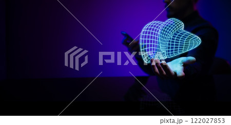 Man presenting a glowing holographic liver, symbolizing medical advancements in organ research and healthcare technology. 122027853
