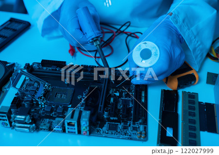Close up of Technician measuring voltage electronic circuit board, Service after sale fix electric equipment. 122027999