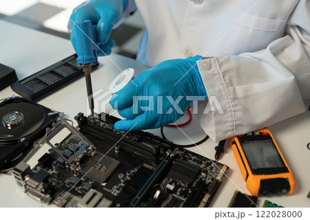 Close up of Technician measuring voltage electronic circuit board, Service after sale fix electric equipment. 122028000
