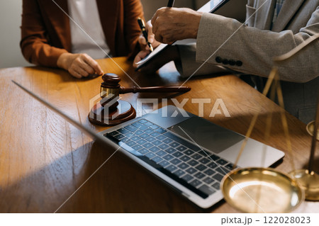 Businessman and lawyer or judge consult having team meeting with client, Law and Legal services concept in office. Businessman and lawyer or judge consult having team meeting with client, Law and Legal services concept in office. 122028023