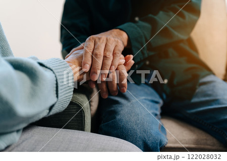 hands of a person who gives reassurance and encouragement to a hopeless person, comforts, gives love, care. 122028032