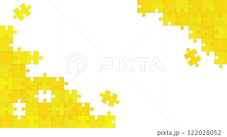 隅で繋がる黄色とオレンジ色のパズルが所々欠けたフレーム 122028052