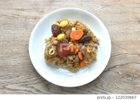 sticky rice steam with pork and salt egg couple wholegrain of Chinese Duanwu festival on plate 122030667
