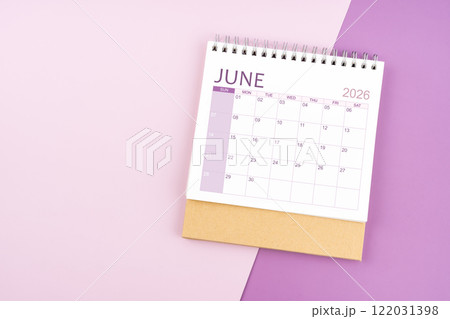 June 2026 desk calendar on pink and purple background. June 2026 desk calendar on pink and purple background. 122031398