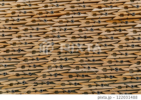 texture of wooden clothespins. wooden clips attached to each other texture of wooden clothespins. wooden clips attached to each other 122031488