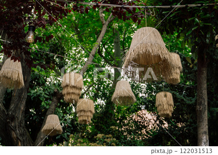 straw lampshade on summer cafe. designer lamps in istanbul cafe 122031513