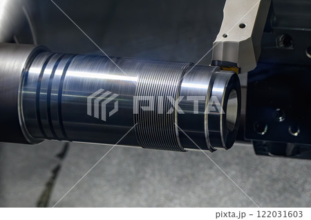 The CNC lathe machine forming cutting the metal shaft parts. The CNC lathe machine forming cutting the metal shaft parts. 122031603
