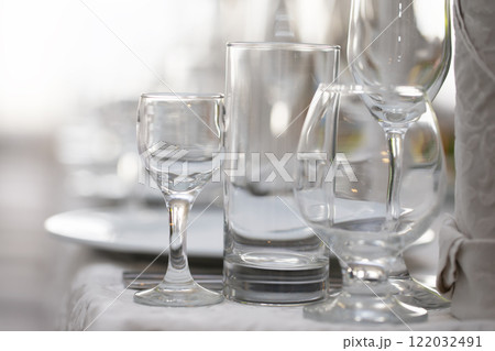 Various glass glasses on the restaurant table. Various glass glasses on the restaurant table. 122032491