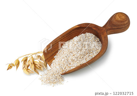 oat bran in scoop and ears near isolated on white oat bran in scoop and ears near isolated on white 122032715