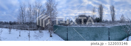 Winter sky in the village with soft pastel hues Winter sky in the village with soft pastel hues 122033146