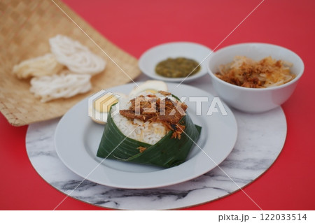 rice with meat on the top and egg , cracker and side dishes rice with meat on the top and egg , cracker and side dishes 122033514