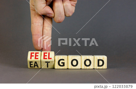 Eat and feel good symbol. Concept words Eat good Feel good on wooden cubes. Beautiful grey table grey background. Doctor hand. Healthy lifestyle eat and feel good concept. Copy space. Eat and feel good symbol. Concept words Eat good Feel good on wooden cubes. Beautiful grey table grey background. Doctor hand. Healthy lifestyle eat and feel good concept. Copy space. 122033879