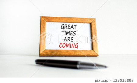 Great times are coming symbol. Concept words Great times are coming on beautiful wooden picture frame. Beautiful white table white background. Business great times are coming concept. Copy space. 122033898