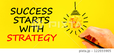 Success starts with strategy symbol. Concept words Success starts with strategy on beautiful yellow paper. Beautiful yellow background. Business and success starts with strategy concept. Copy space. Success starts with strategy symbol. Concept words Success starts with strategy on beautiful yellow paper. Beautiful yellow background. Business and success starts with strategy concept. Copy space. 122033905