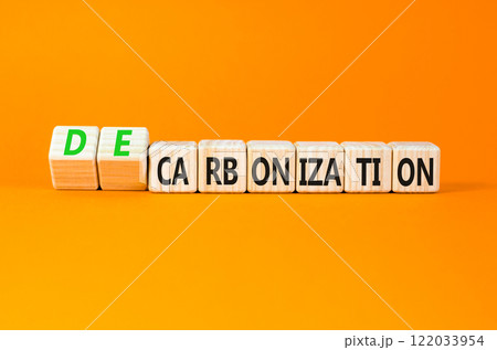 Decarbonization or carbonization symbol. Concept words Decarbonization or Carbonization on wooden blocks. Beautiful orange background. Business decarbonization or carbonization concept. Copy space. Decarbonization or carbonization symbol. Concept words Decarbonization or Carbonization on wooden blocks. Beautiful orange background. Business decarbonization or carbonization concept. Copy space. 122033954