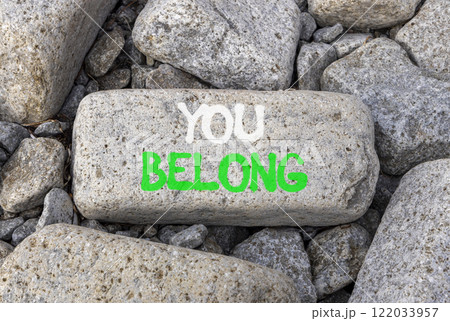 Belonging and you belong symbol. Concept words You belong on beautiful grey stone. Beautiful grey stones background. Business belonging and you belong concept. Copy space. 122033957