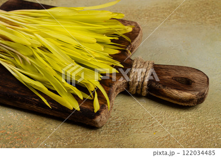 a microgrown corn, a bouquet on a cutting wooden board, no people, 122034485