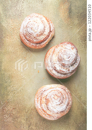 bakery product, lemon twist, with white glaze, sweet bun, muffin, pastries, top view, no people, bakery product, lemon twist, with white glaze, sweet bun, muffin, pastries, top view, no people, 122034510