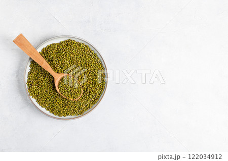 Top view organic mung beans on grey background copy space Top view organic mung beans on grey background copy space 122034912