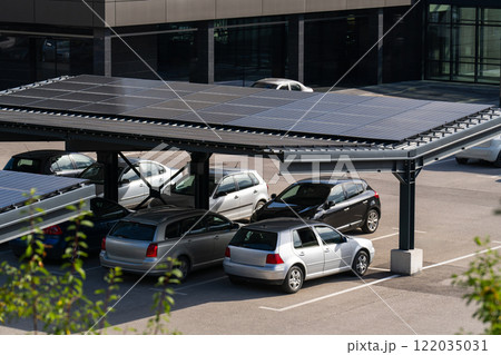 Parking space with solar panels on a roof 122035031
