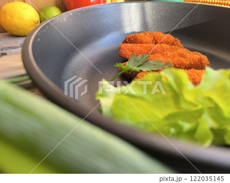 Chicken nuggets in a frying pan Chicken nuggets in a frying pan 122035145