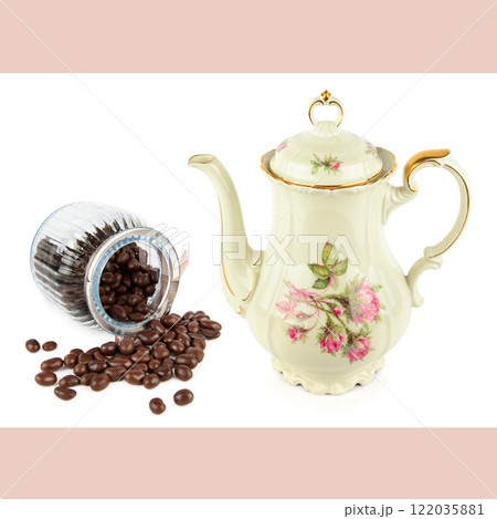 Elegant vintage porcelain coffee pot and roasted coffee beans isolated on white background. Elegant vintage porcelain coffee pot and roasted coffee beans isolated on white background. 122035881
