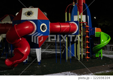 Playground at night in the park under a street lamp 122036104
