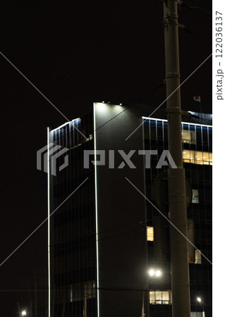 Illumination of a tall building in Minsk. University building at night Illumination of a tall building in Minsk. University building at night 122036137