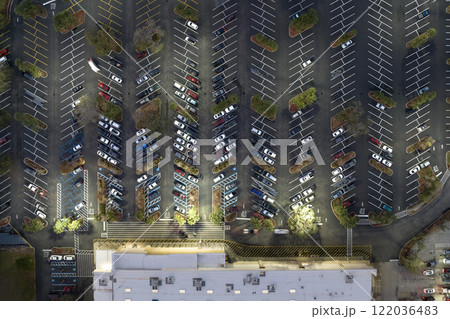 Top view of many cars parked on a parking lot in front of a shopping mall in Florida. Concept of urban transportation 122036483