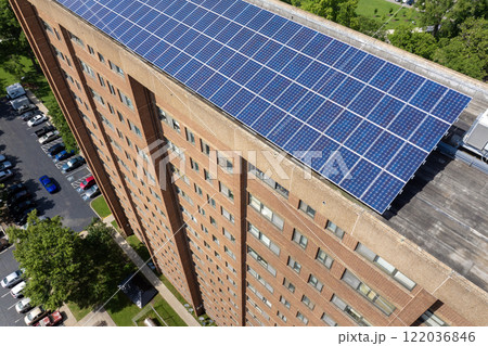 Photovoltaic panels on solar rooftop of condo building for producing clean ecological electrical energy. Renewable electricity with zero emission concept 122036846