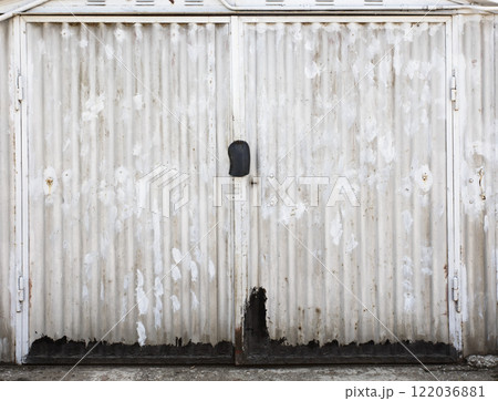 old metal door to the car garage old metal door to the car garage 122036881