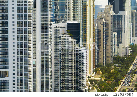 Expensive highrise hotels and condos on Atlantic ocean shore in Sunny Isles Beach city. American tourism infrastructure in southern Florida Expensive highrise hotels and condos on Atlantic ocean shore in Sunny Isles Beach city. American tourism infrastructure in southern Florida 122037094