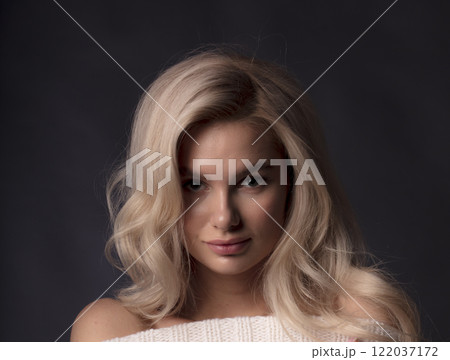 young beautiful woman on a dark background, full length studio shot 122037172