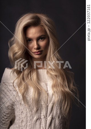 young beautiful woman on a dark background, full length studio shot young beautiful woman on a dark background, full length studio shot 122037181