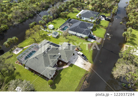 Aftermath of natural disaster. Surrounded by hurricane Ian rainfall flood waters homes in Florida residential area Aftermath of natural disaster. Surrounded by hurricane Ian rainfall flood waters homes in Florida residential area 122037284