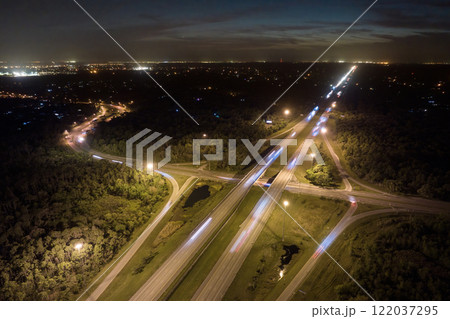 American highway bridge with fast moving traffic in evening. Interstate transportation concept American highway bridge with fast moving traffic in evening. Interstate transportation concept 122037295