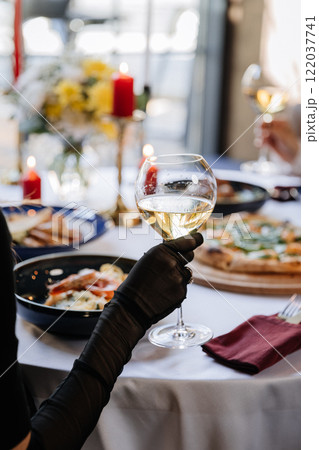 Elegant dining setting with wine and gourmet dishes, perfect for luxurious celebrations or dinners 122037741