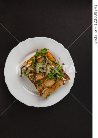 Rotten mandarin with mold and spoiled appearance on a white plate Rotten mandarin with mold and spoiled appearance on a white plate 122039241