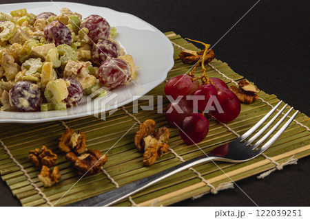 Repotting plants on a balcony using gloves and a watering can Repotting plants on a balcony using gloves and a watering can 122039251