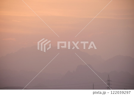 Sunset landscape with dark mountain peaks in Egyptian desert Sunset landscape with dark mountain peaks in Egyptian desert 122039297