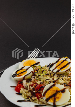 Nighttime view of the moon hidden in clouds over Lviv, Ukraine 122039313