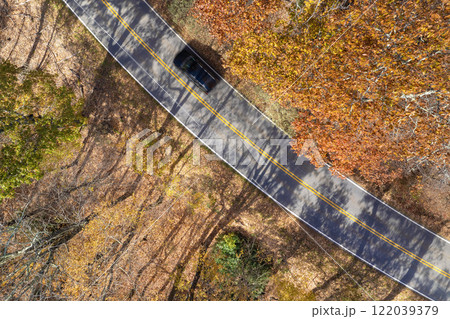 Road trip travel in Appalachian mountains. Car driving on parkway through woods nature in fall season. Colorful forest in autumn Tennessee 122039379
