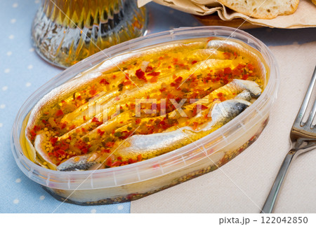 Herring preserves in a plastic jar Herring preserves in a plastic jar 122042850