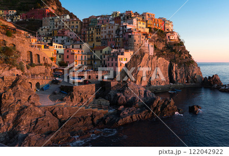Colorful Manarola on coastline on sunset in Italy Colorful Manarola on coastline on sunset in Italy 122042922