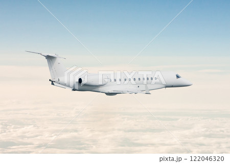 White luxury private jet flying in the air above the clouds 122046320