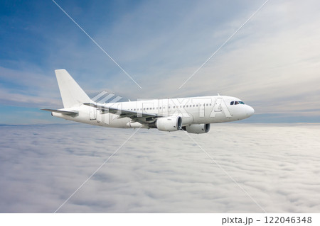 White passenger jetliner fly in the air above the clouds 122046348